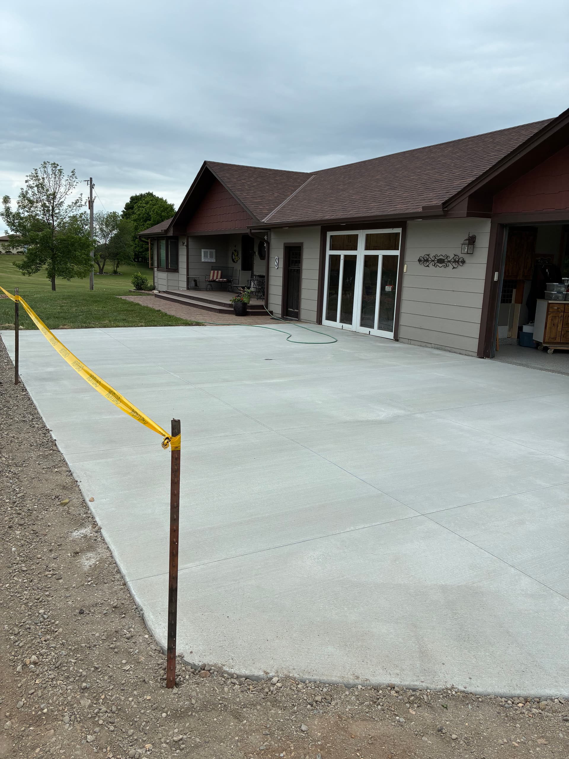 New Concrete Driveway and Epoxy Garage Floor Done Right